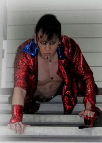 a man in a red and blue outfit on the stairs
